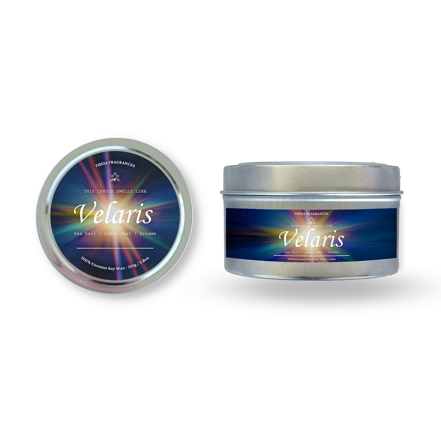 The 'Velaris' coconut soy wax candle by Theia Fragrances is demonstrated in the 11G tin candle. The label features a burst of starlight. It is styled on an open book with decorative crystals and flowers.