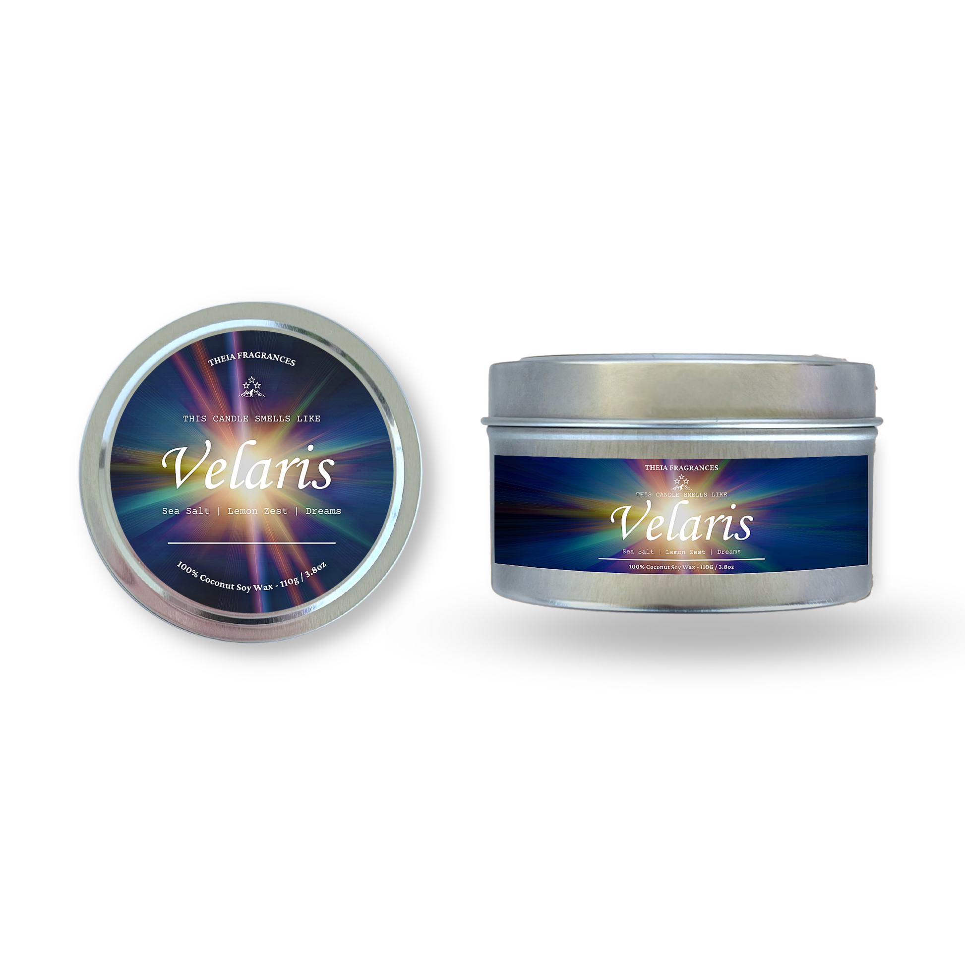The 'Velaris' coconut soy wax candle by Theia Fragrances is demonstrated in the 11G tin candle. The label features a burst of starlight. It is styled on an open book with decorative crystals and flowers.